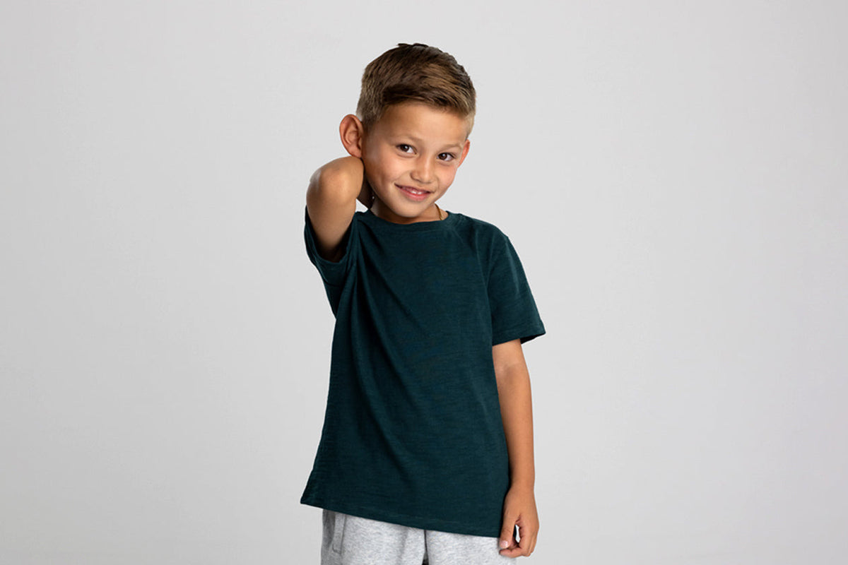 Boy in a dark green kids Slub Tee